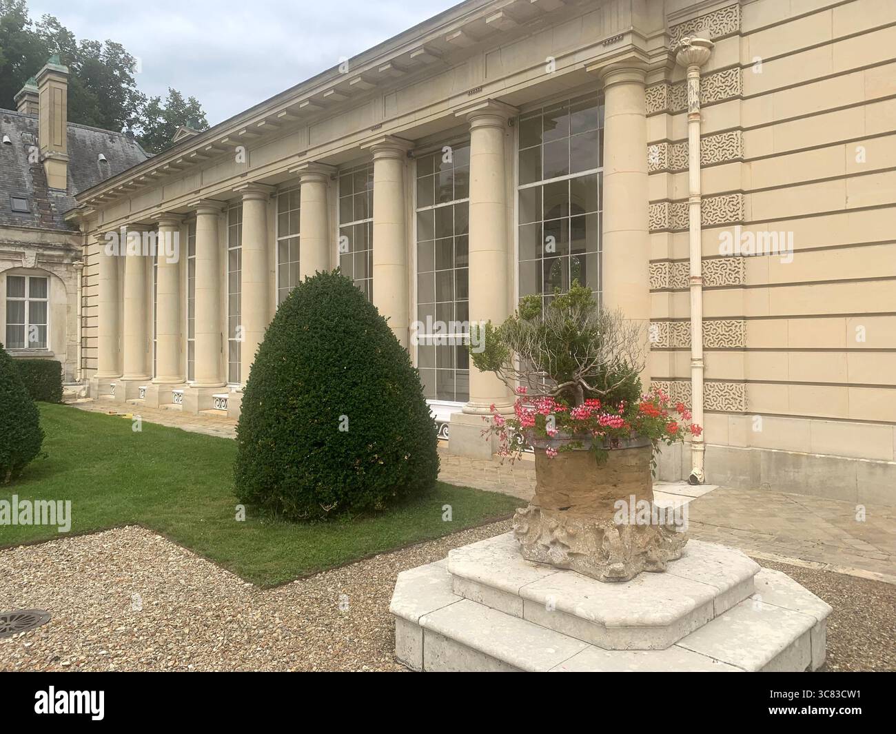 Chateau Bizi France French monument historic place gardens museum old ancient fountain water lake piano harp playing play people performance - Smartphone Captured Stock Image