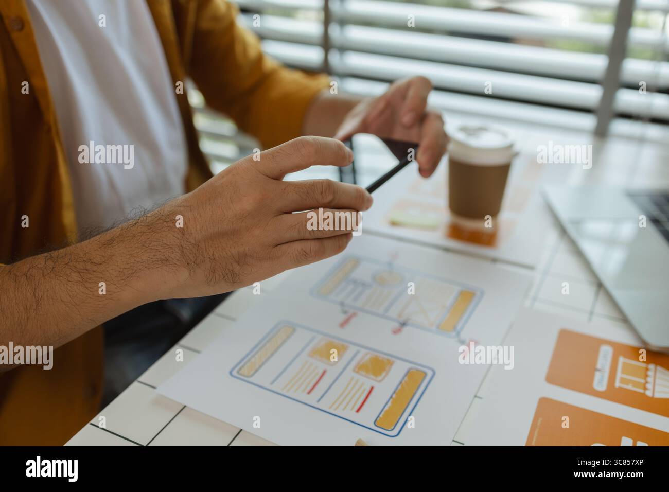A web developer, as a User Experience and User Interface Officer is analyzing data from his ideas to develop the structure and components of a digital Stock Photo