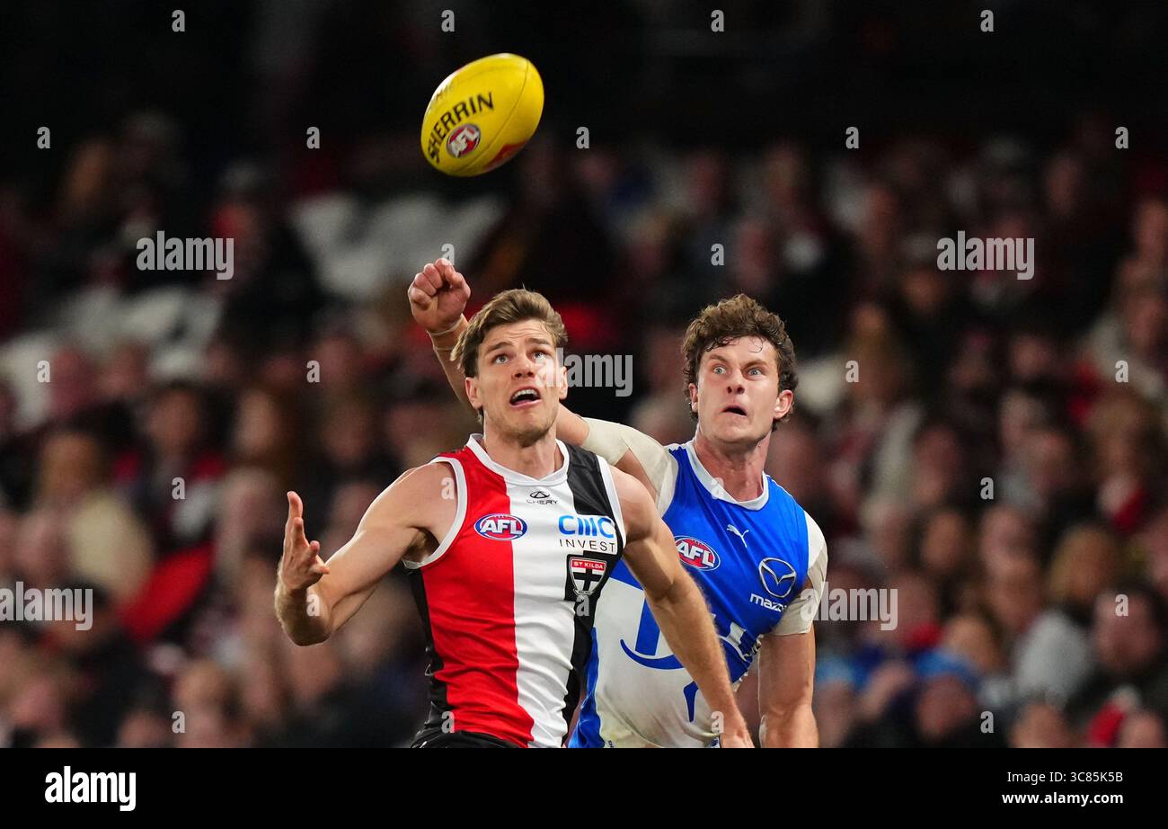 Comben Mason Wood of the Saints and Charlie Comben of the Kangaroos compete ...