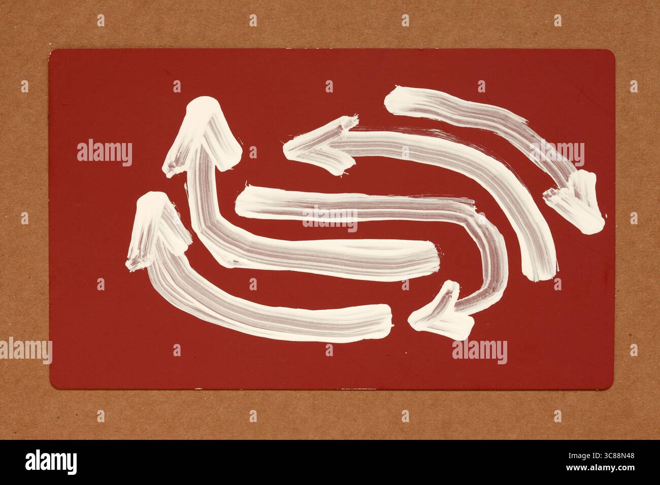 white color panted arrows on red Stock Photo