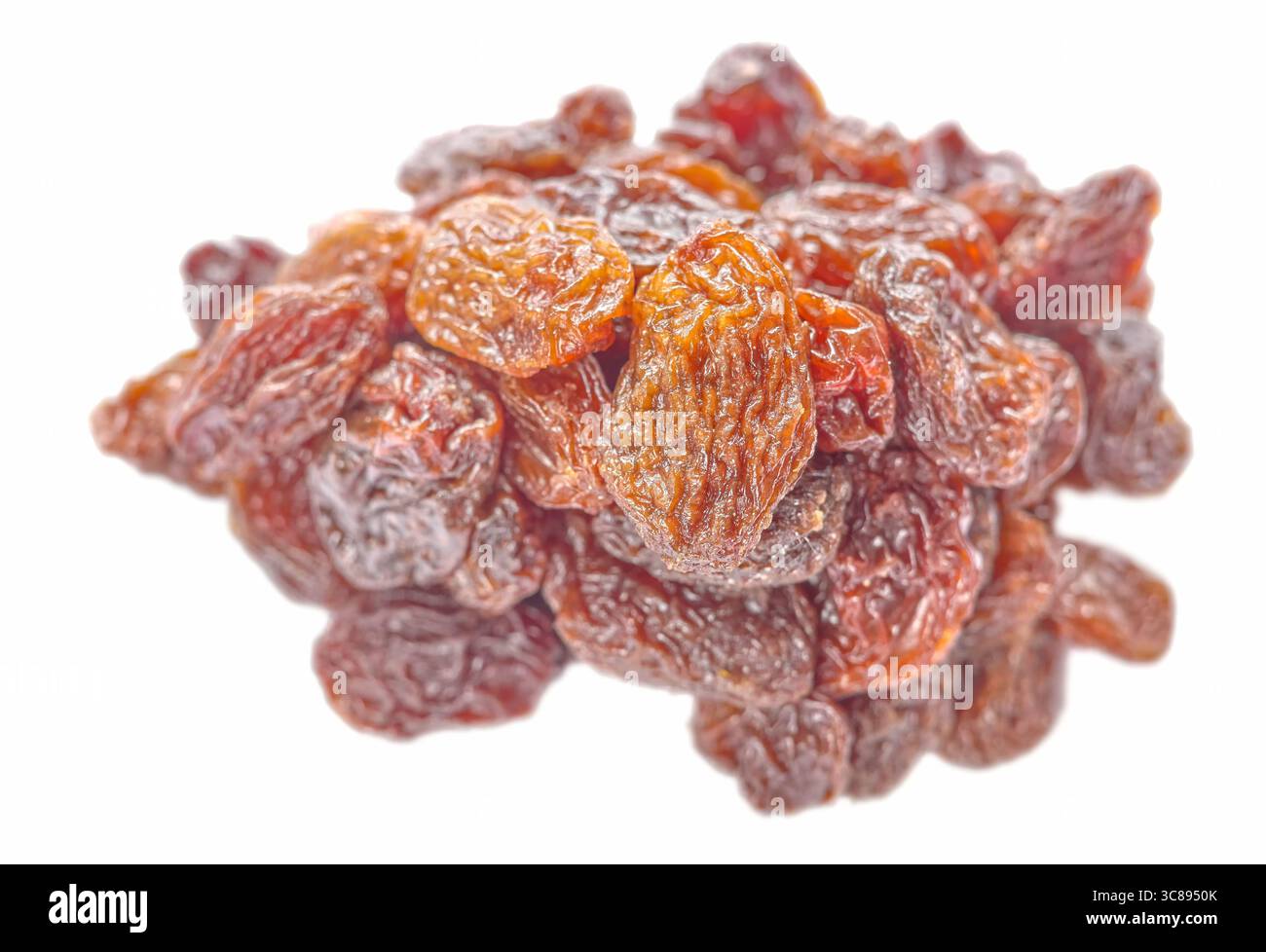 Organic raisins isolated on white background, selective focus. Stock Photo