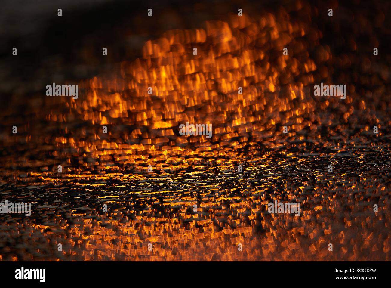 Gilded Ripples Dance Upon Molten Waters Stock Photo