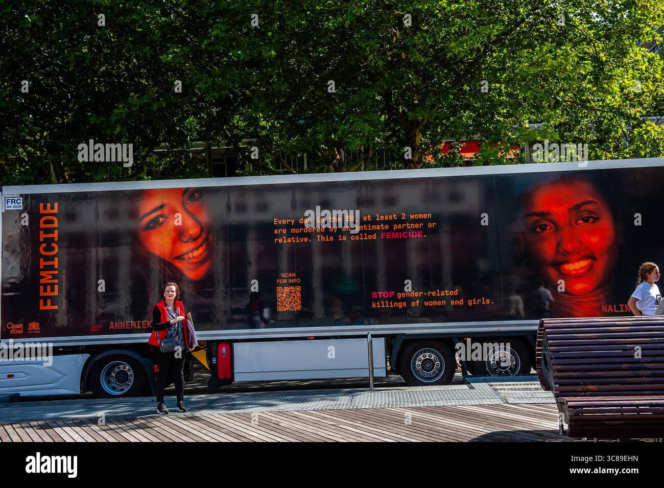 A huge truck displays information about femicide during a demonstration against femicide in Rotterdam. The Dutch feminist organization 'Dolle Mina' held a national protest march against femicide in Rotterdam. This is in response to two murders of women in less than a week. In both cases, the suspect turned out to be a (former) partner of the victim.'Dolle Mina' demands that femicide must be recognized as a 'specific and structural form of gender-based violence.' During the speech of one of the parents of one of the victims, a man ran onto the stage and tried to disrupt the event. Stock Photo