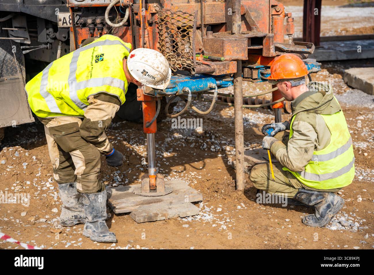 Pile Sampling Belovo, Russia - May 18, 2025: Close-up of soil sampling during pile ...