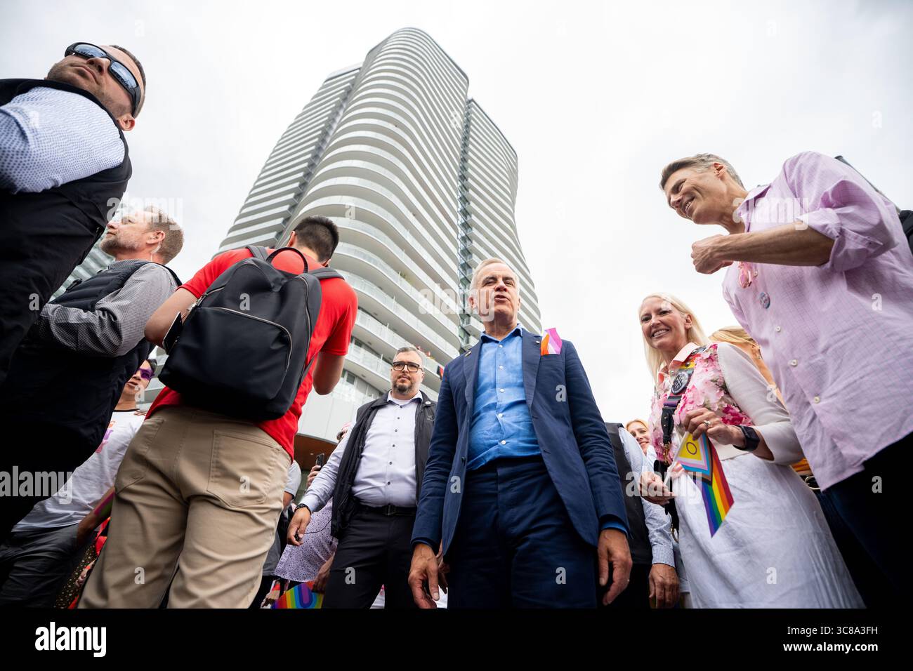 Prime Minister Mark Carney marches in the Vancouver Pride Parade in
