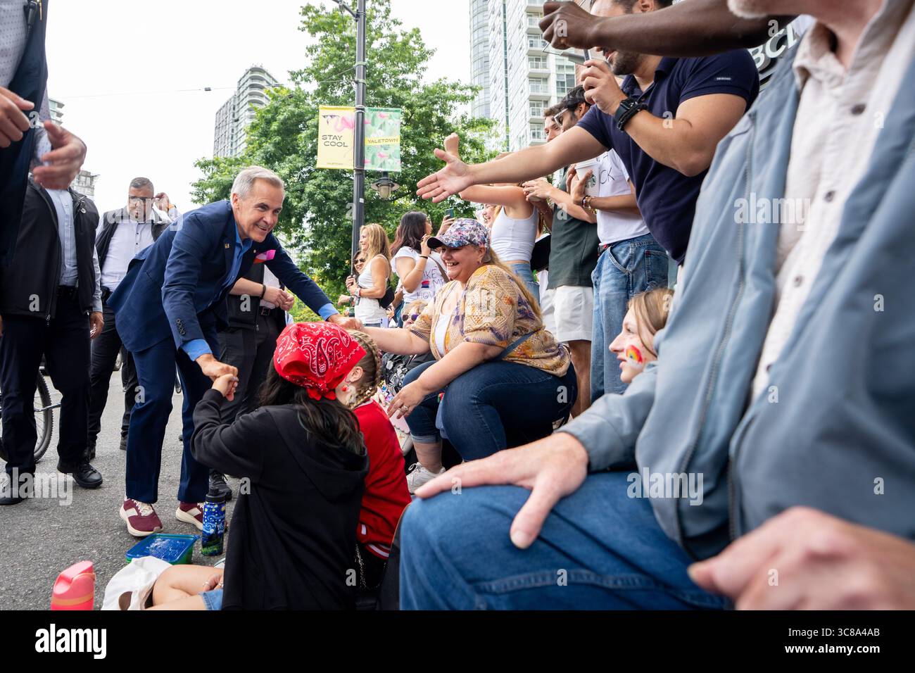 Prime Minister Mark Carney greets people during the Vancouver Pride