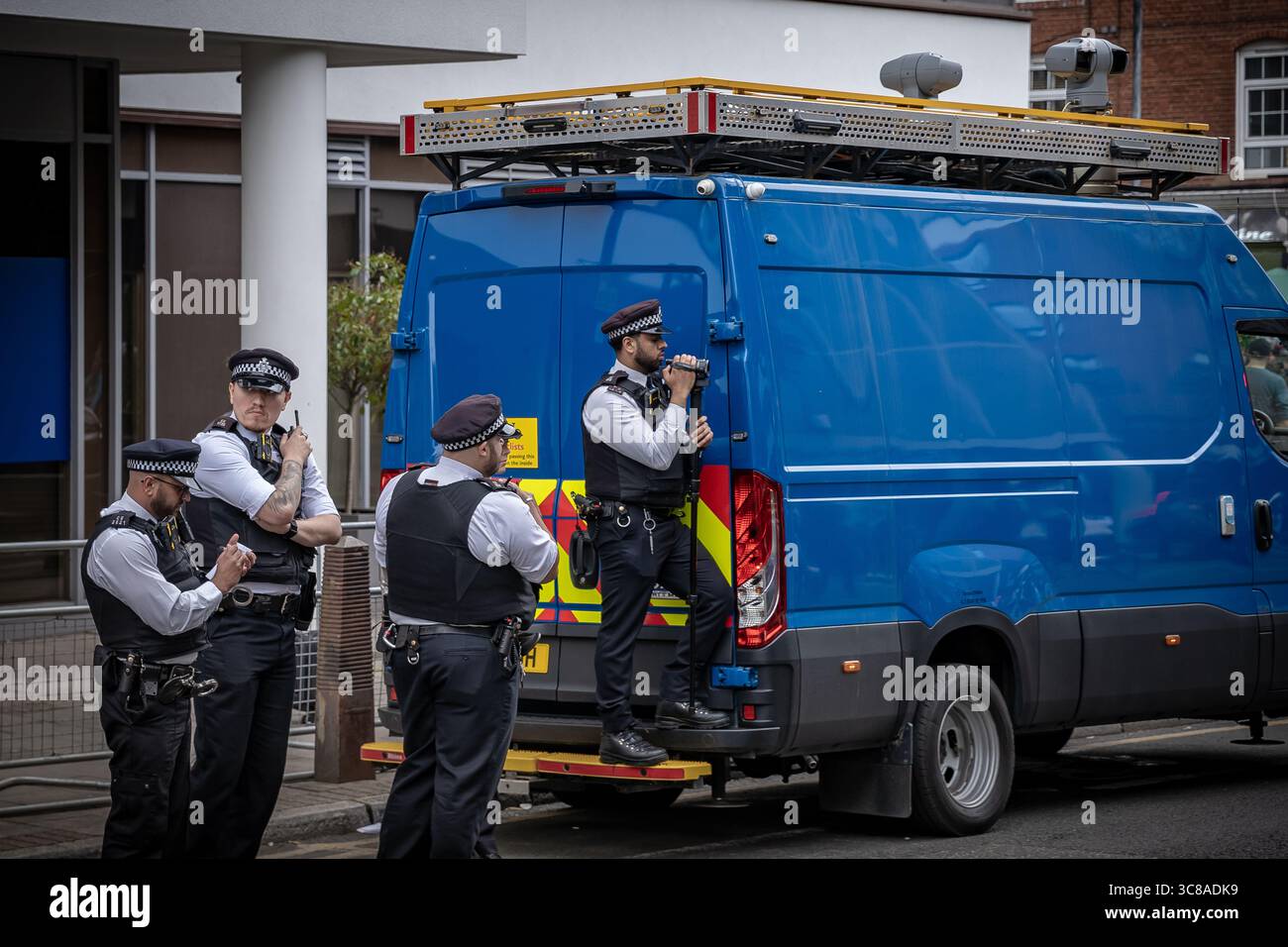 London, UK. 2nd August 2025. Police video surveillance unit along with facial-recognition vans monitor both pro- and anti-migrant protesters as they face off near the Thistle City Barbican hotel in Islington currently housing asylum seekers. Stand Up to Racism supporters(pictured) and other anti-racism demonstrators turned out in large numbers to counter-protest against those opposed to it being used as Home Office accommodation. Police made a number of arrests after scuffles broke out. Credit: Guy Corbishley/Alamy Live News Stock Photo