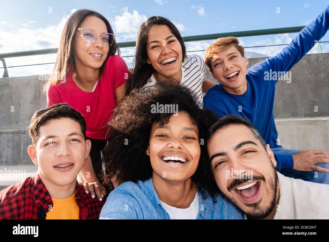 Multiracial friends taking selfie celebrating outdoors in summer Stock Photo
