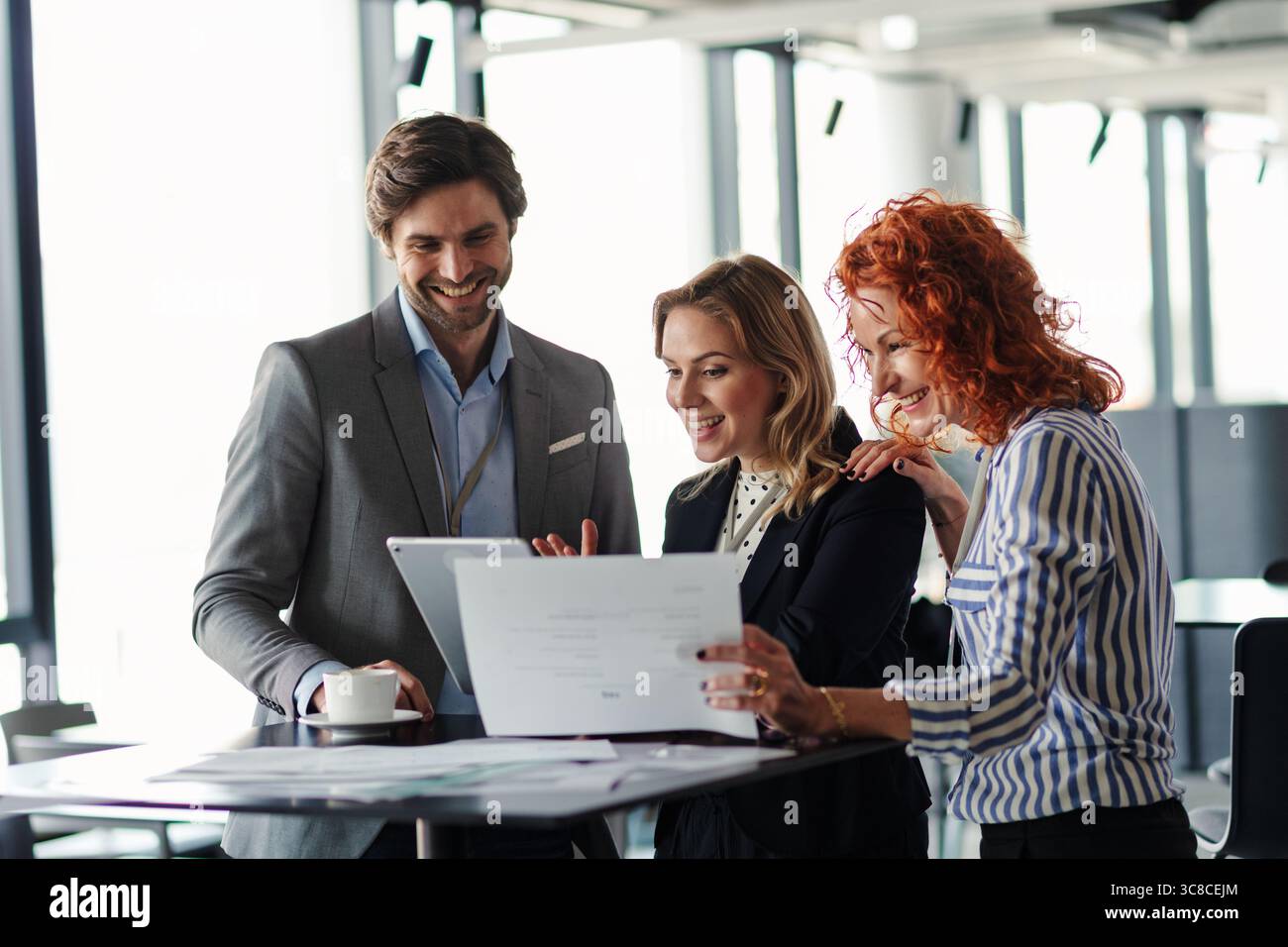 Business colleagues sharing ideas, discussing new project. Stock Photo