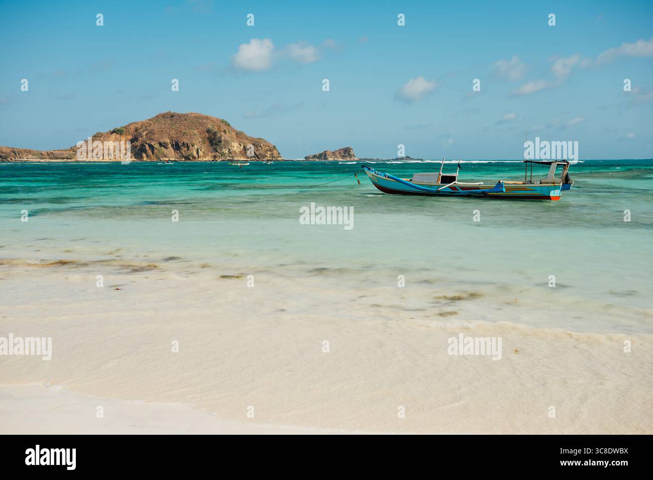 Boat on Turquoise Water and White Sand, Tanjung Aan Beach, Lombok Stock Photo