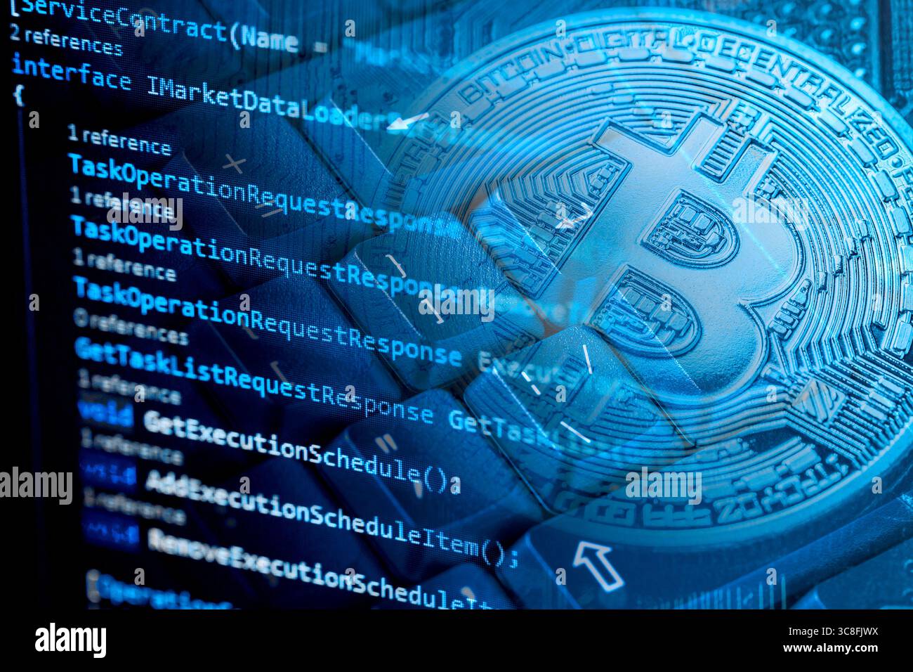 Information technology concept. Coding programmer language script text on screen monitor display with a PC keyboard and bitcoin cryptocurrency. Select Stock Photo