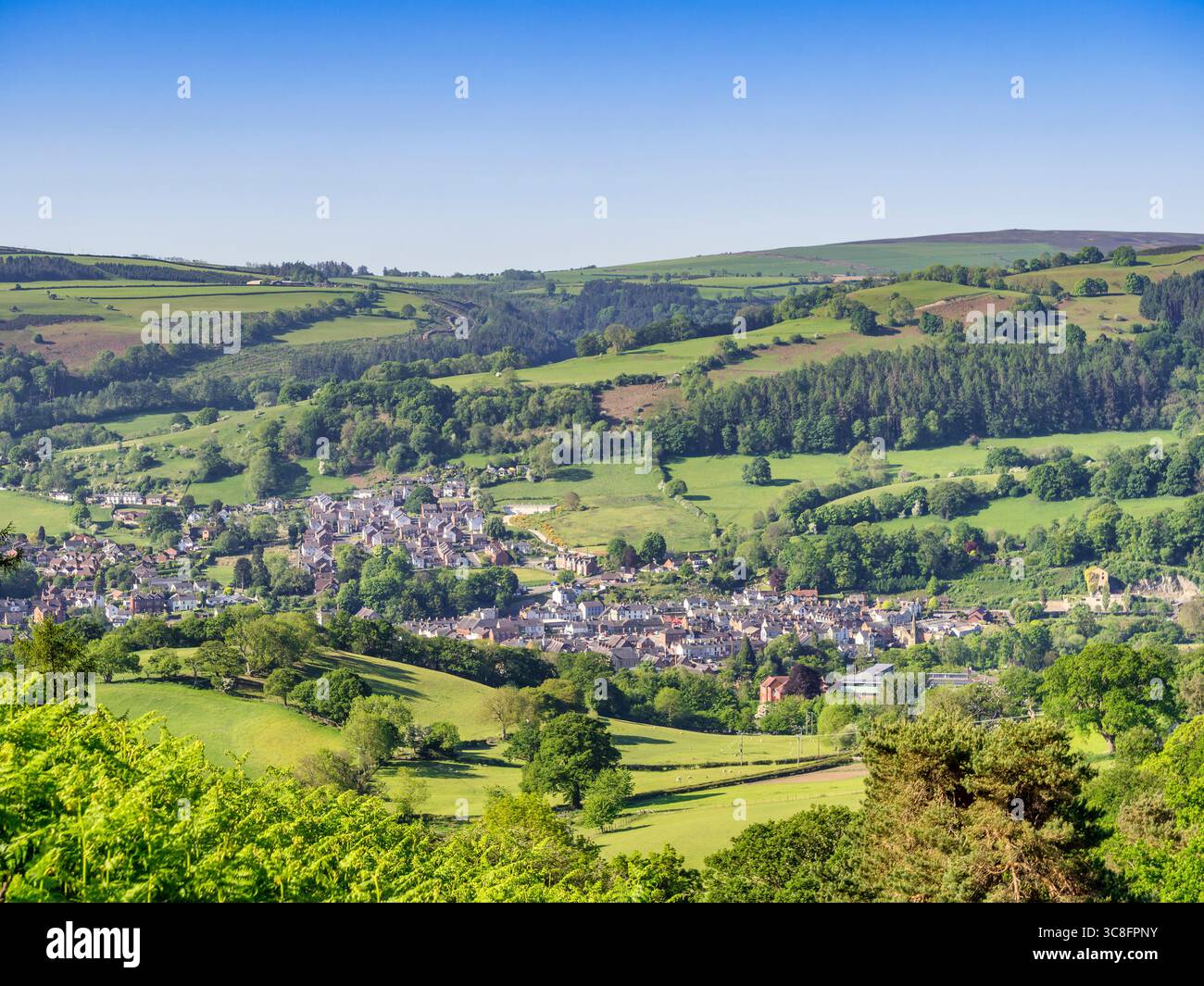 Llangollen and the Dee Valley, from Castell Dinas Bran, with beautifull spring greens and clear blue sky. Stock Photo