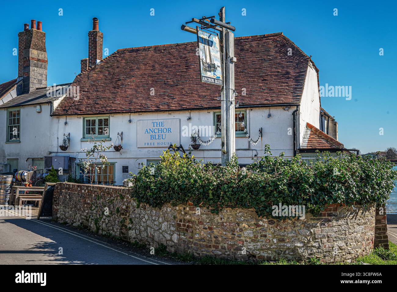 The Anchor Bleu, a harbourside public house in the picturesque West Sussex village of Bosham. Stock Photo