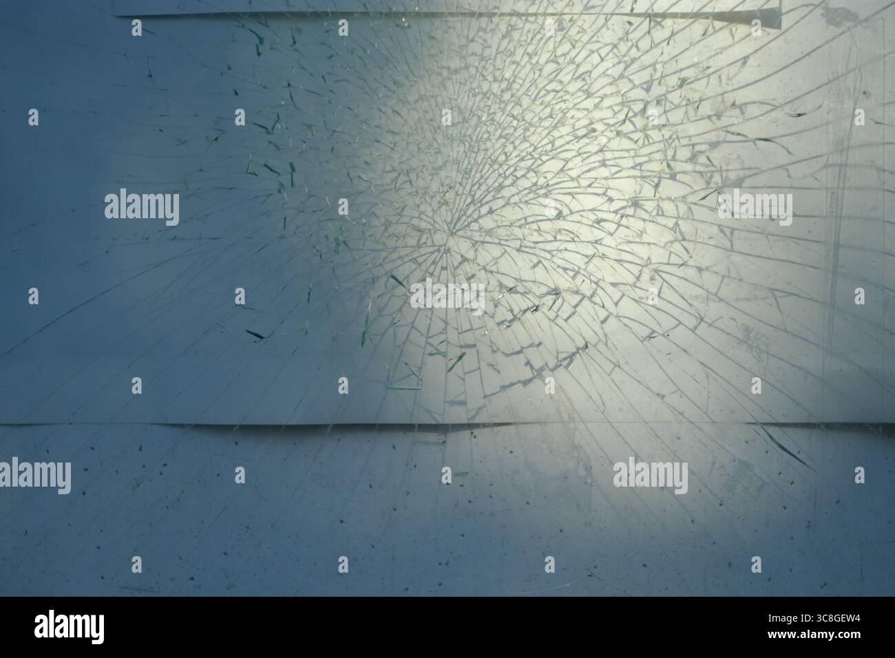Sunlight refracting through broken window glass, creating fragmented ...