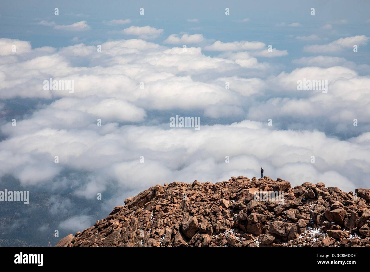 Colorado Springs, Colorado - A man stands on the rocks just below the ...