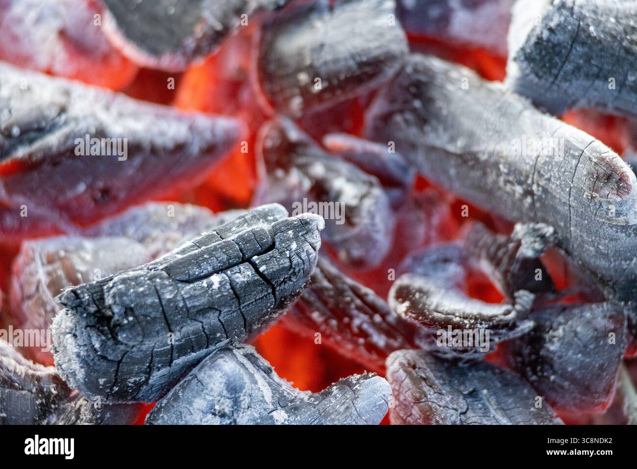 burning red coals in charcoal grill, selective focus Stock Photo