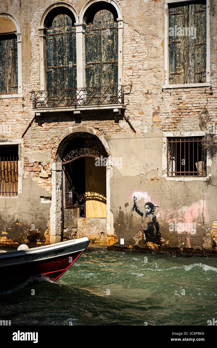 Rustic Graffiti Graffiti by a Venetian canal with rustic houses in the historic old ...