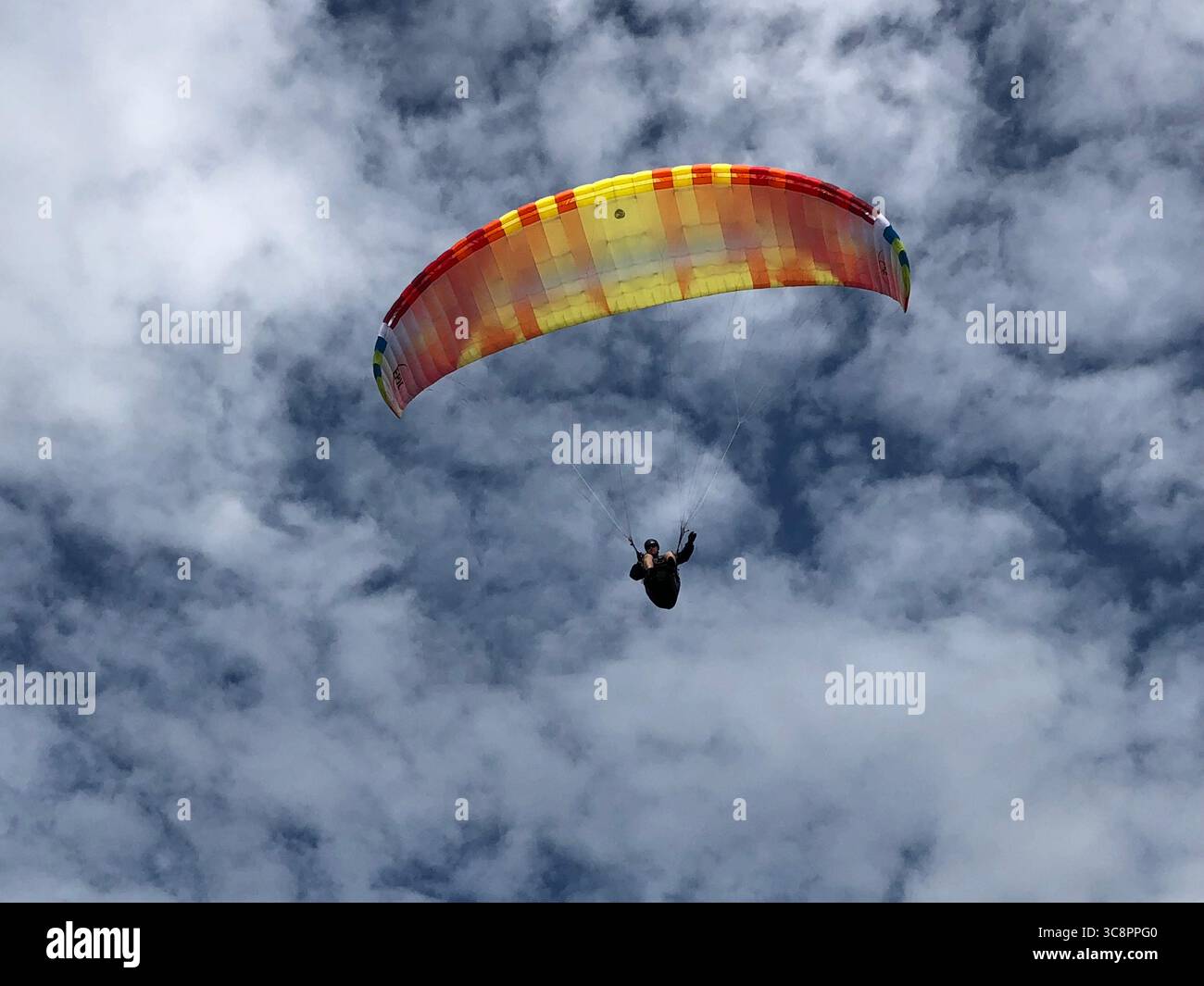 Paraglider Solo in Barnicote Ranges NZ - Smartphone Captured Stock Image
