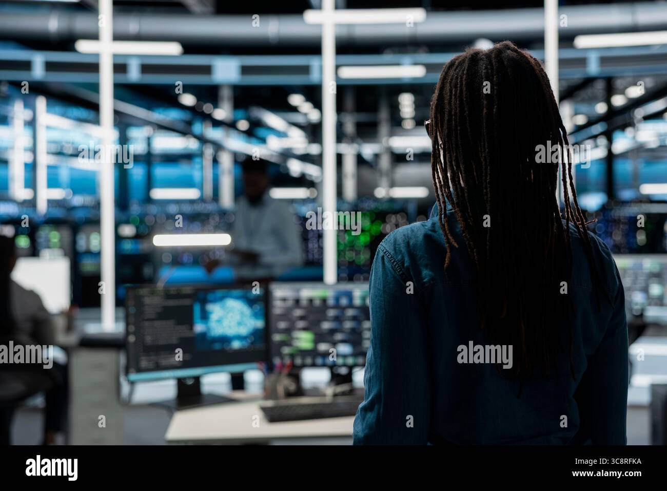 System administrator entering data center office, preparing to use artificial intelligence computerized model. Server room employee arriving at work, starting job shift, using AI Stock Photo