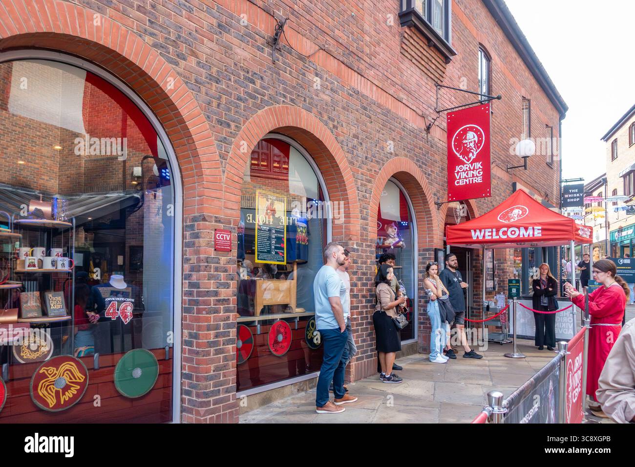 Visitors wait to enter The Jorvik Viking Centre on Coppergate Walk in York, UK Stock Photo