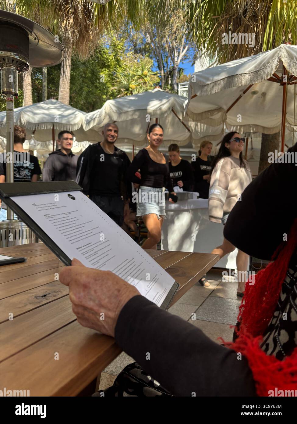 Al fresco diners and passers-by at Rococo restaurant, Hastings Street, Noosa, Sunshine Coast, Queensland, Australia. No MR or PR - Smartphone Captured Stock Image
