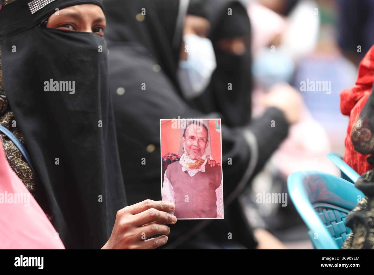 February 20, 2021, Dhaka, Bangladesh: Relatives hold photos of victims ...