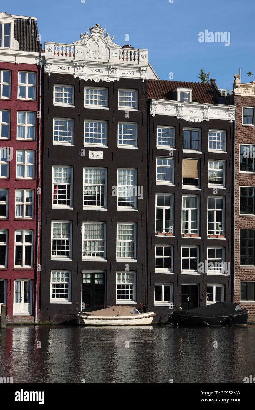 damrak amsterdams famous row of crooked houses Stock Photo