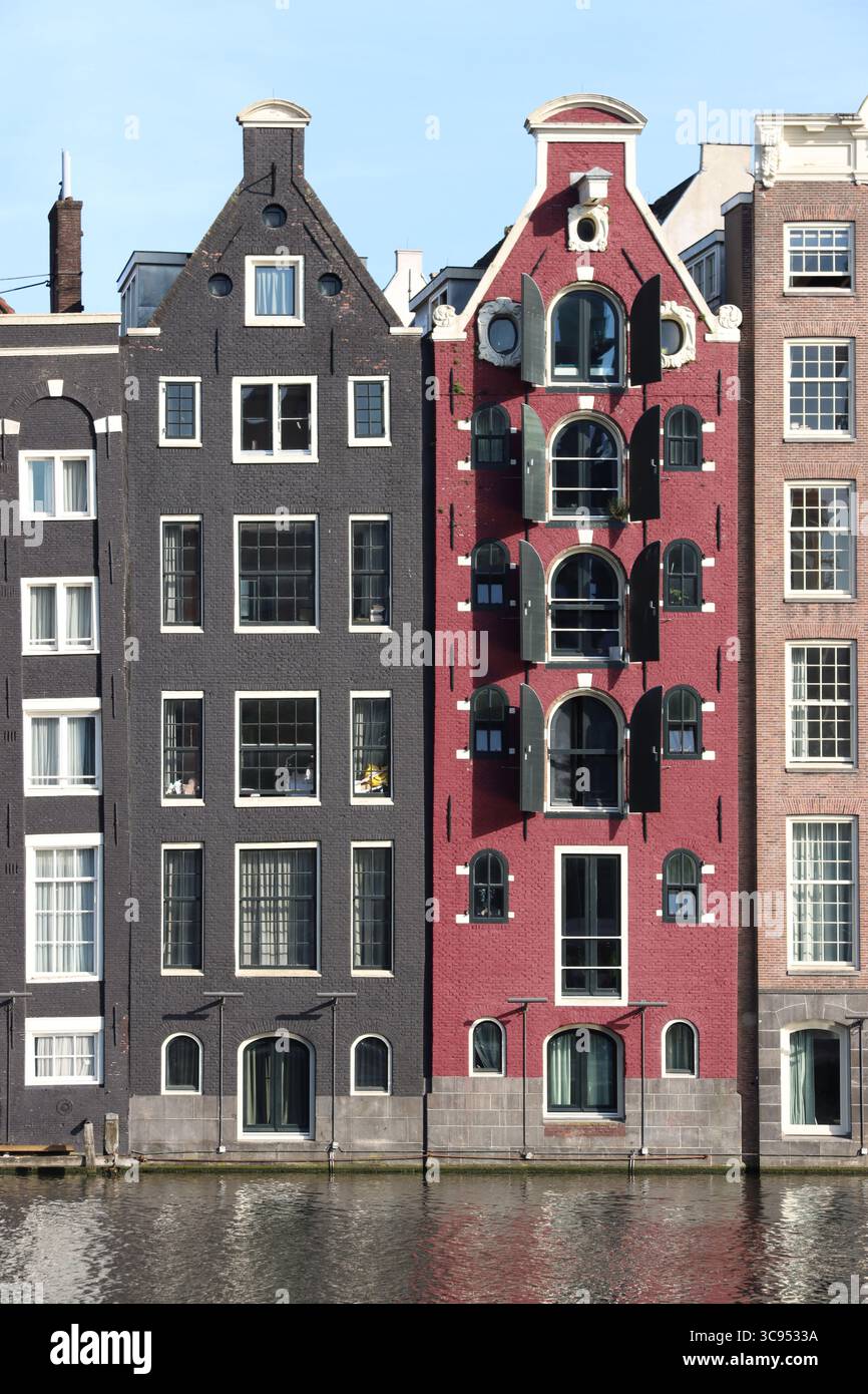 damrak amsterdams famous row of crooked houses Stock Photo
