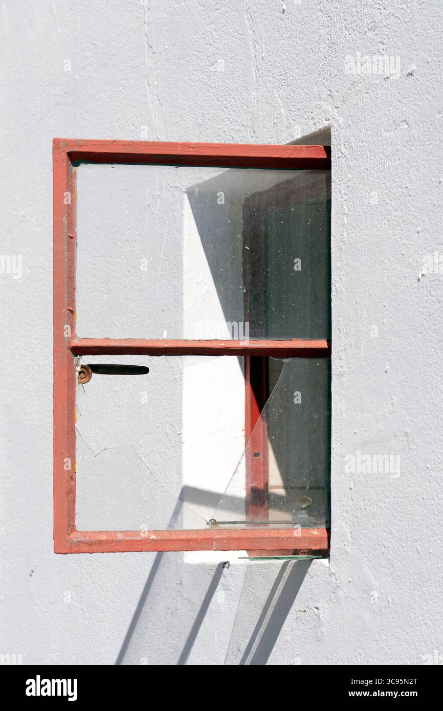 Open Window with Broken Glass Pane Stock Photo