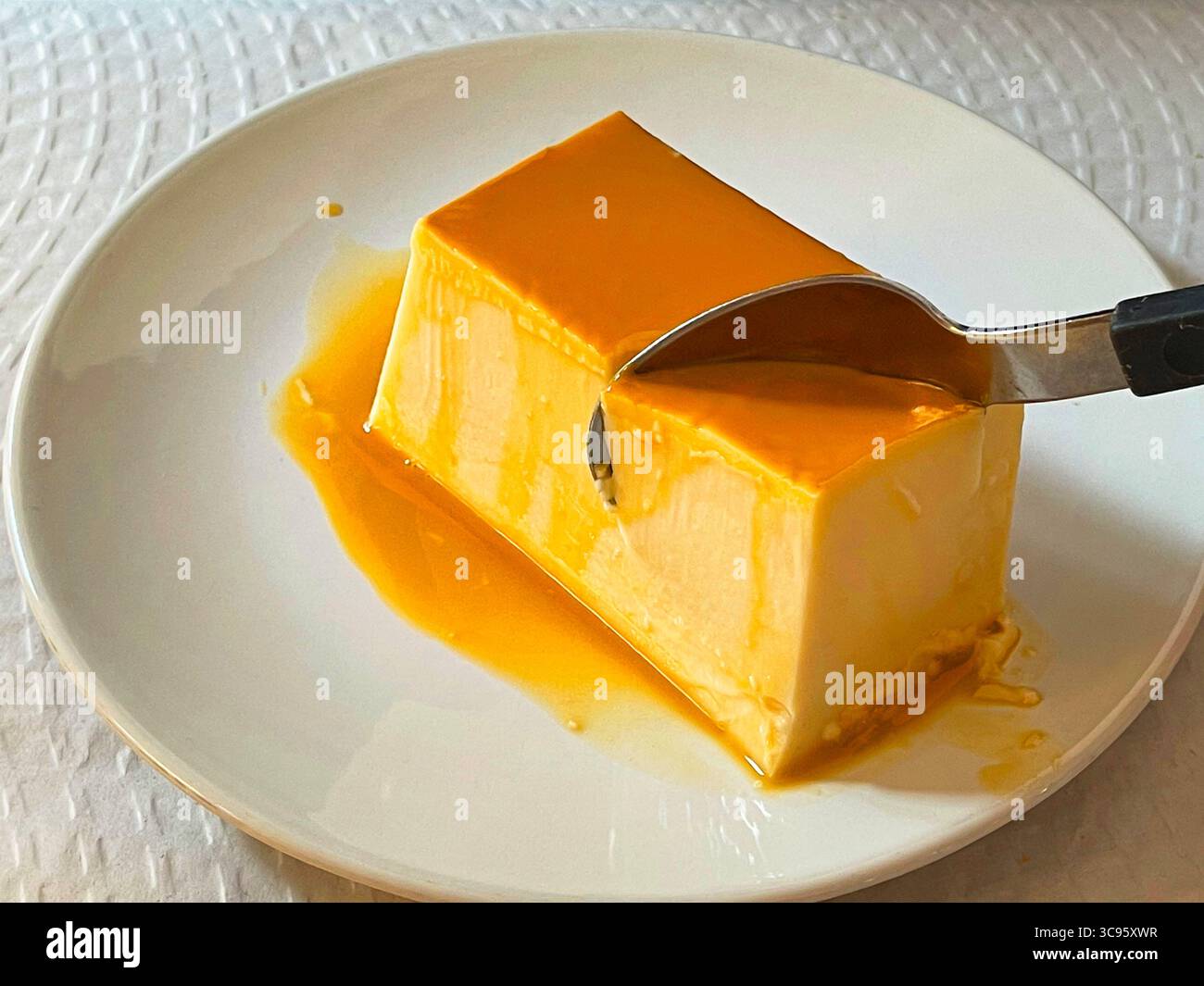 Eating cheese creme caramel. Spain. - Smartphone Captured Stock Image