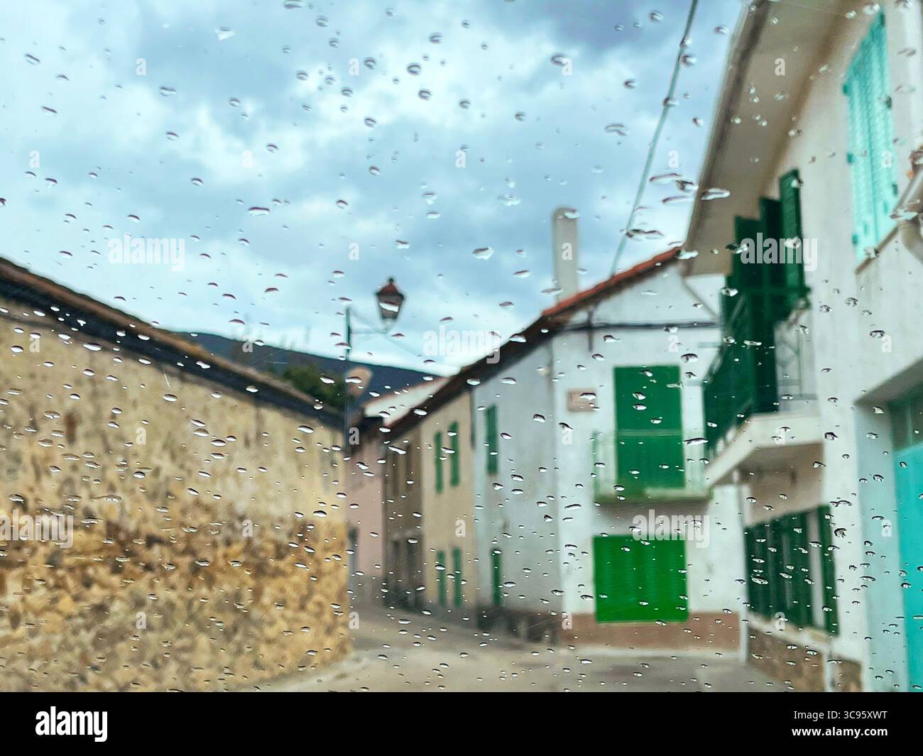Luna street viewed through a wet glass. Lozoya, Madrid province, Spain. - Smartphone Captured Stock Image