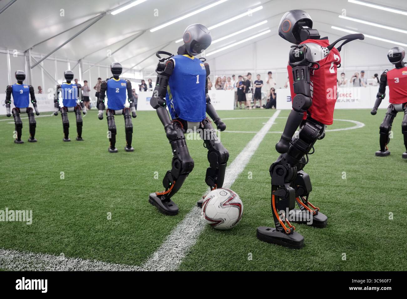 Humonid Practice Humanoid robots take part in a football practice match in Beijing on ...