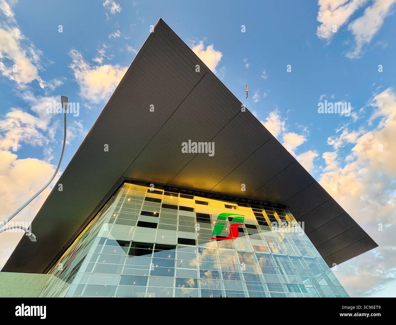 View of Tiburtina Station's suspended canopy—a steel-and‑glass roof hovering over the platforms, Rome, Italy. - Smartphone Captured Stock Image