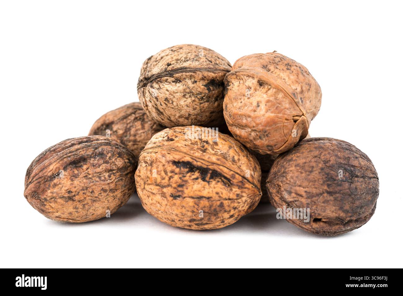 Some walnuts isolated on white background with shadows Stock Photo