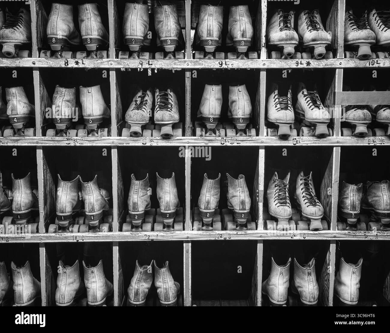 Rental skates lined up at the roller rink in black an white - Smartphone Captured Stock Image