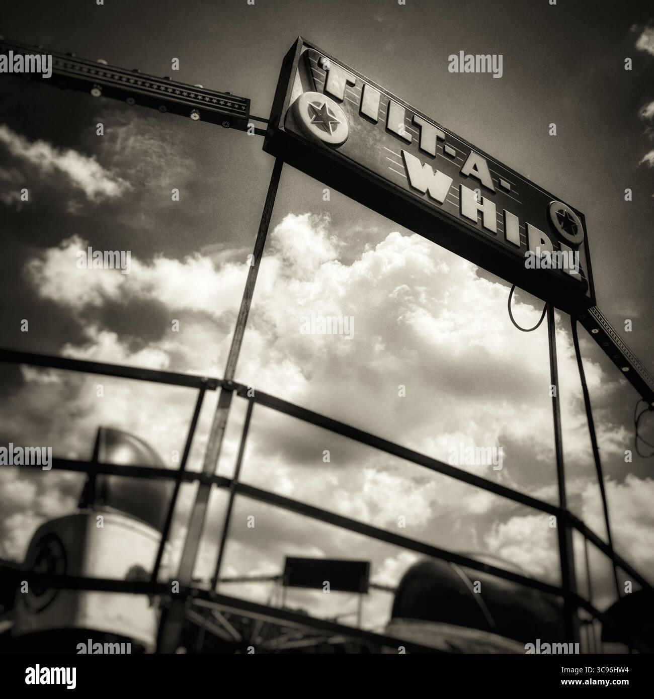 Tilt-a-Whirl ride at the county fair in sepia tone - Smartphone Captured Stock Image