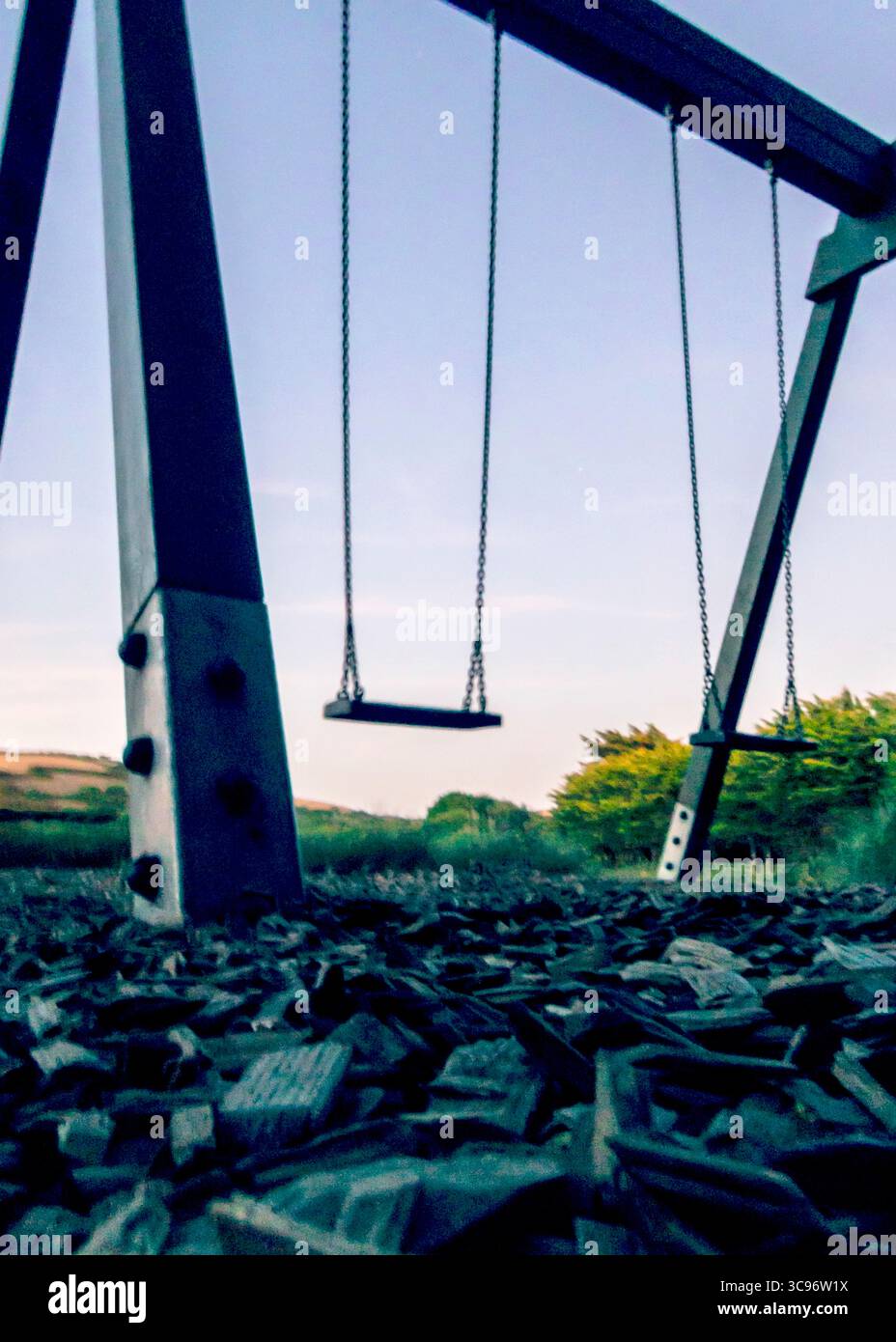 An empty swing set in a park. Stock Photo