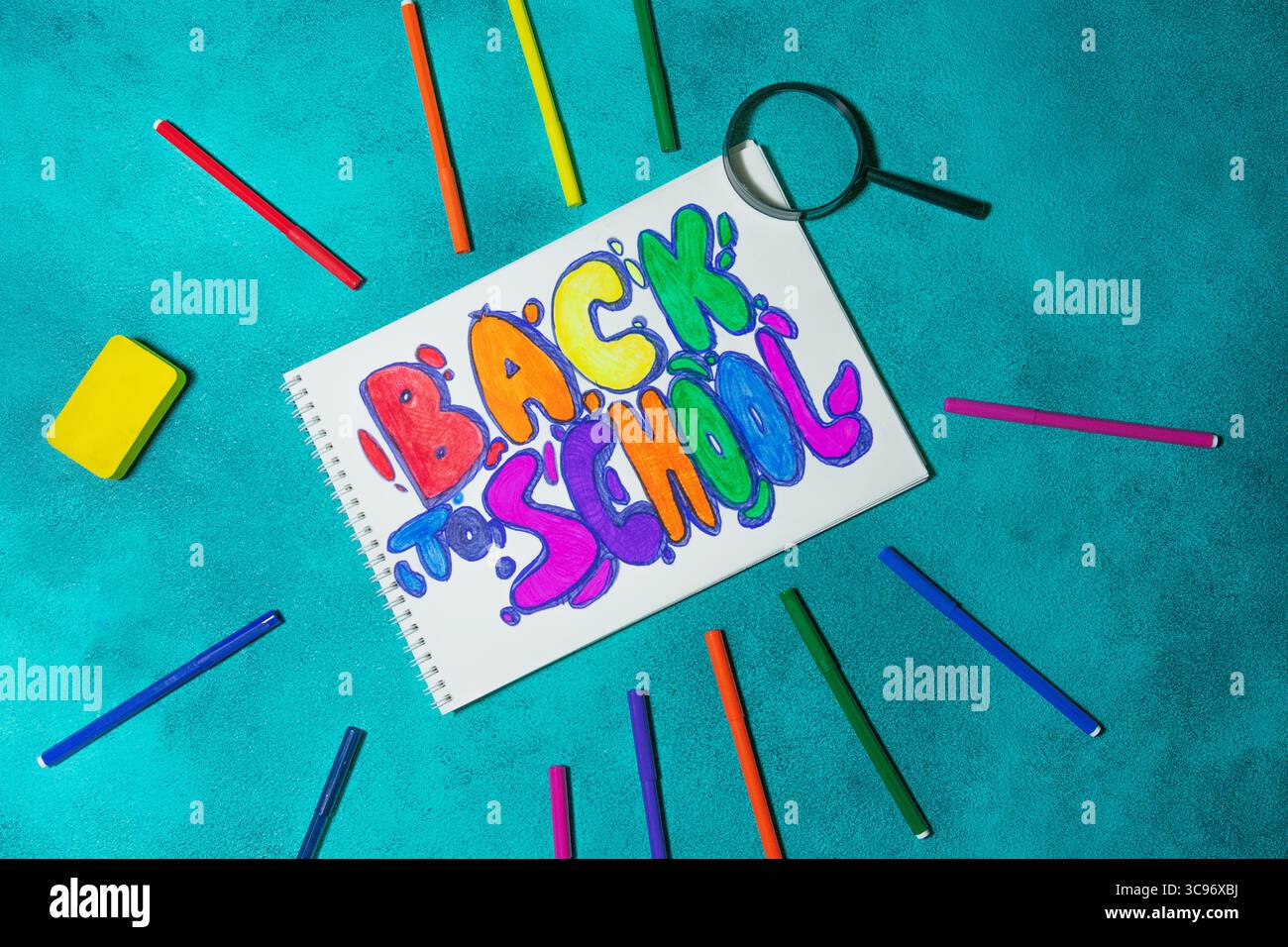 Back to School Spiral Notebook with Magnifying Glass and Markers Stock ...