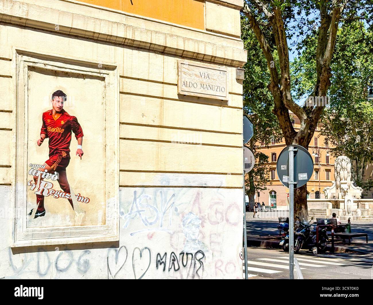 Street poster of young Francesco Totti with “Eppoi arrivò ’l Regazzino” (“And then the kid arrived”), Rome, Italy - Smartphone Captured Stock Image