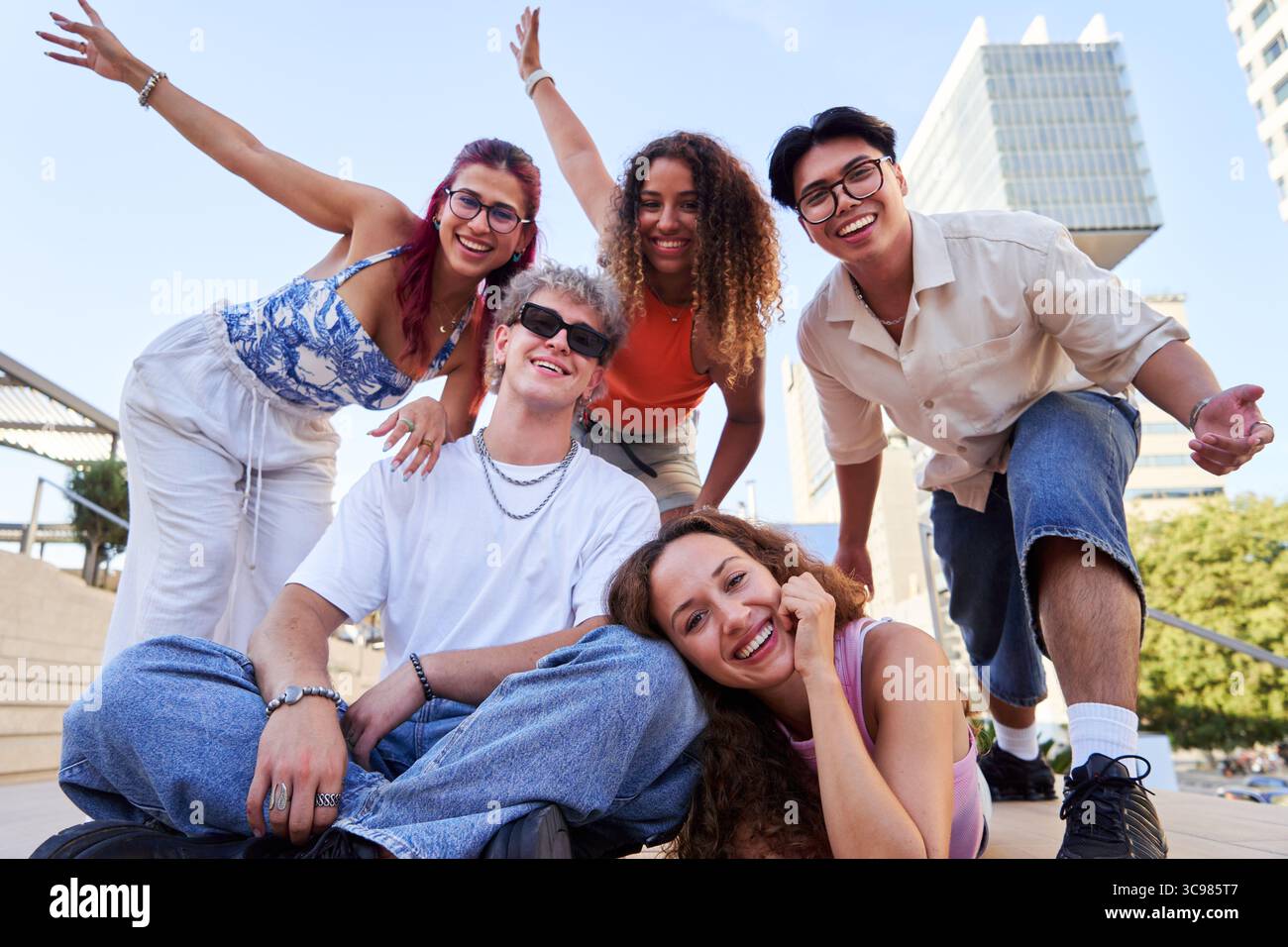 Group of young people smiling and having fun outdoors. Stock Photo