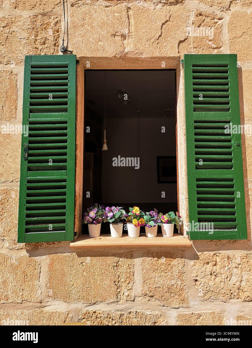 Alcúdia Old Town, Mallorca – picturesque medieval town with narrow cobblestone streets, lively squares, and historic buildings which has UNESCO status. - Smartphone Captured Stock Image