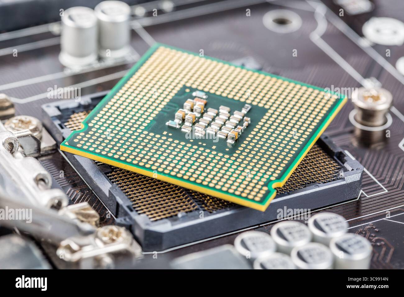 CPU installation close up in the motherboard Stock Photo - Alamy