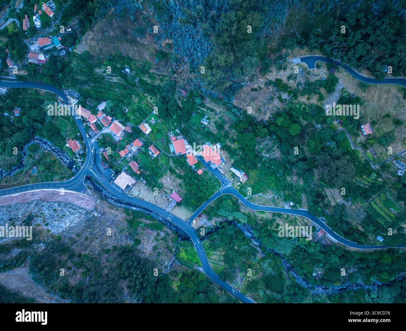 Curral das Freiras is a scenic village in Madeira, nestled in a deep valley and surrounded by dramatic mountains aerial views. Stock Photo