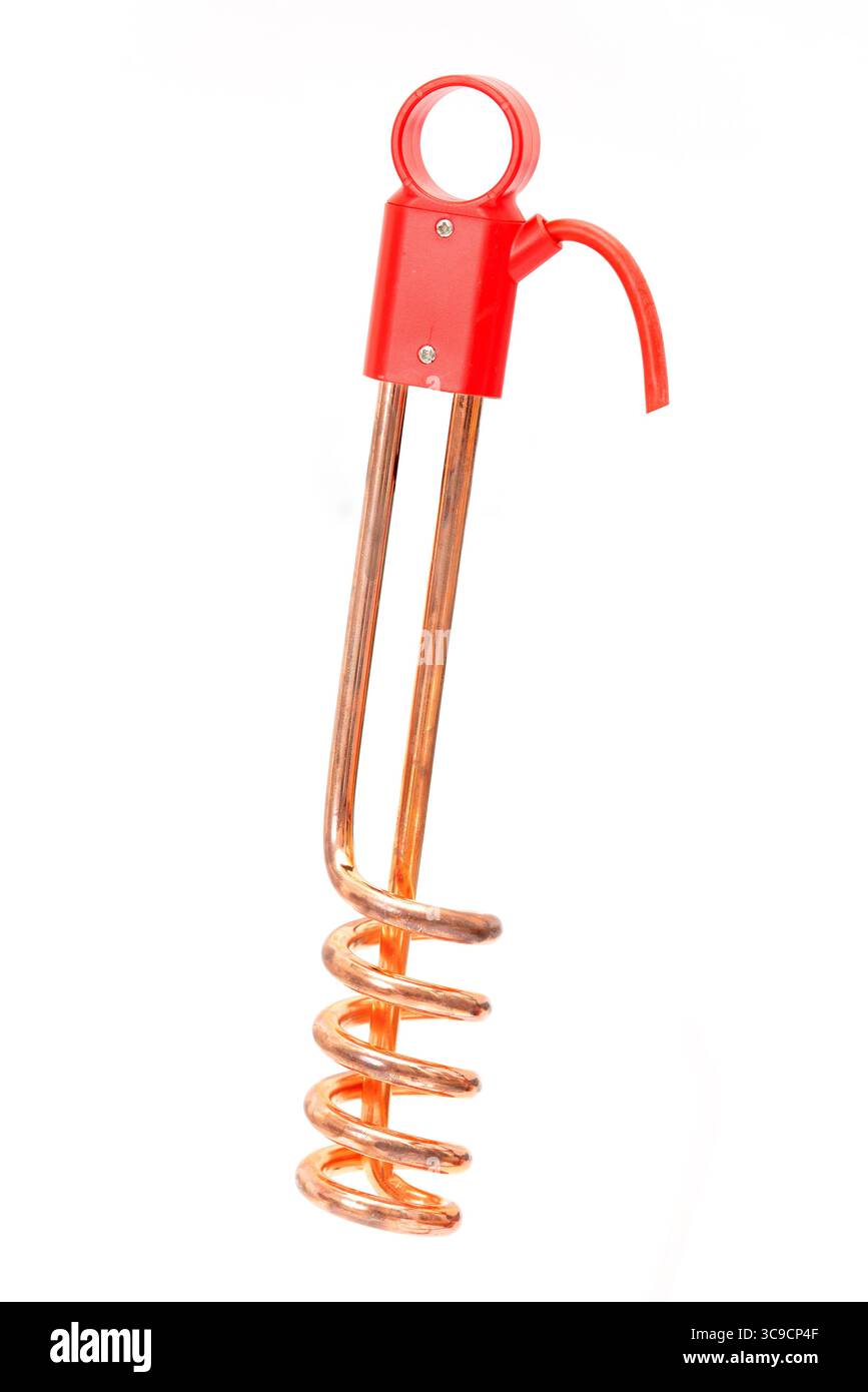 Copper immersion water heater with red plastic handle isolated on white background, used for quick water heating. Stock Photo