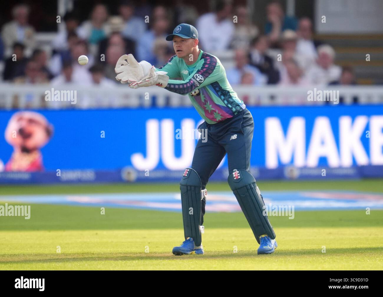 Sam Riling's Oval Invincibles' Sam Billings attempts to catch the ball during the ...