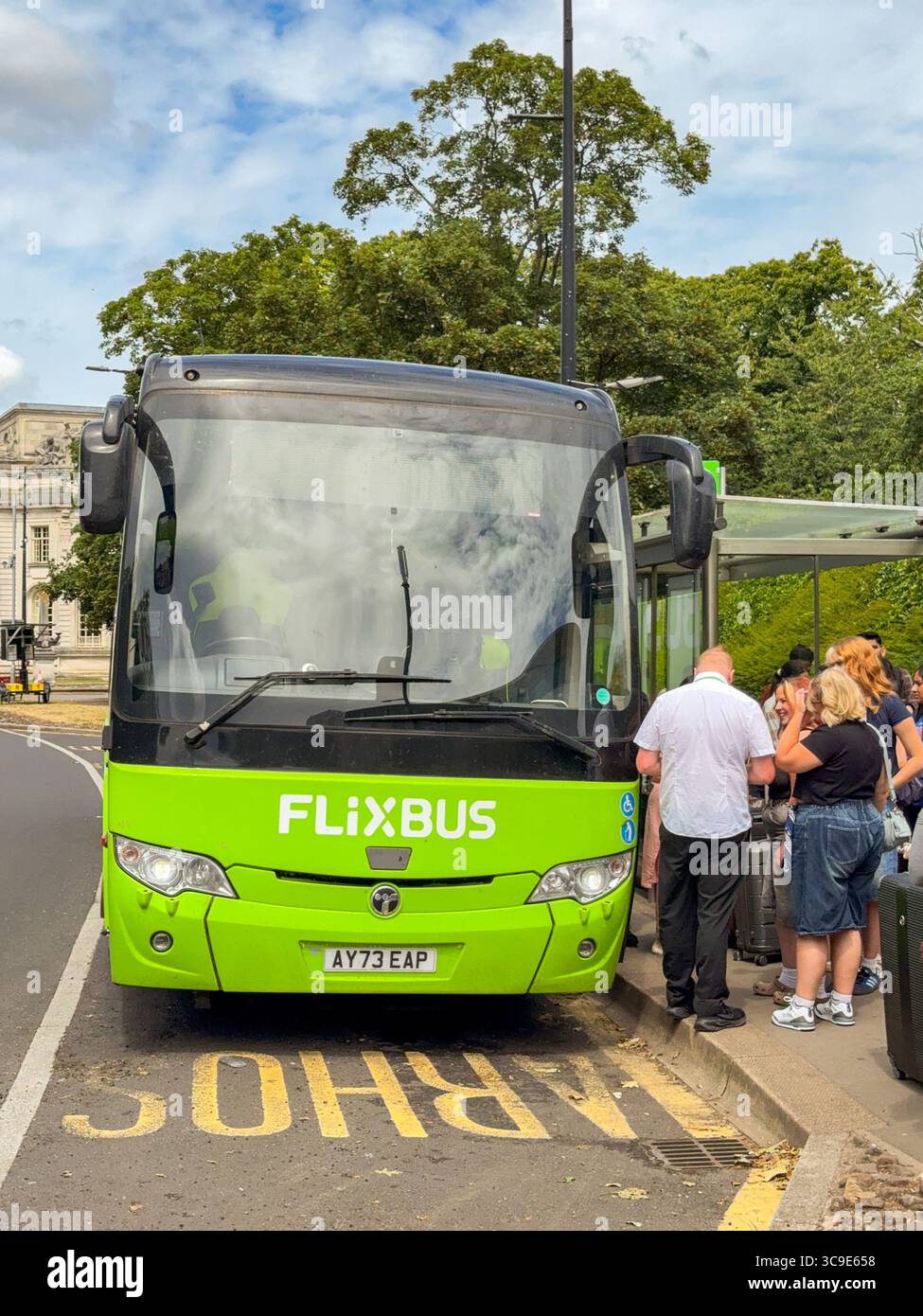 Cardiff, wales, UK - 16 July 2025: Passengers boarding an express coach operated by budget bus operator FlixBus in Cardiff city centre. - Smartphone Captured Stock Image
