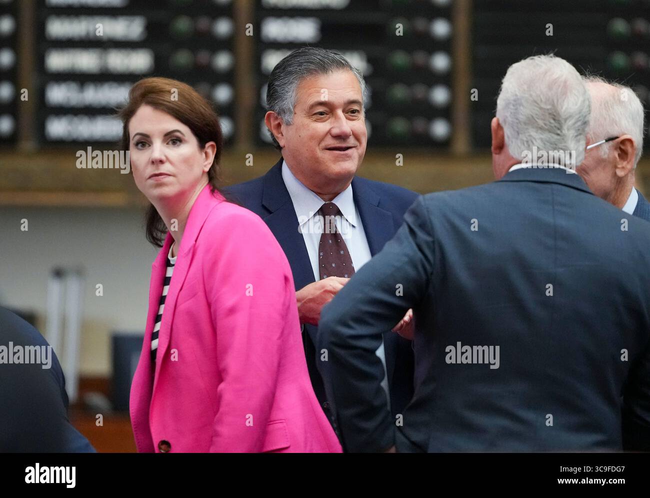 Austin, United States. 05th Aug, 2025. Democratic State Rep. RICHARD RAYMOND, D-Laredo, talks with members along with Rep. ELLEN TROXCLAIR R-Lakeway, during the second day that the Texas House failed to reach a quorum to do business on August 5, 2025. Many Texas Democrats have fled the state under threat of arrest by the Texas Governor. Credit: Bob Daemmrich/Alamy Live News Stock Photo