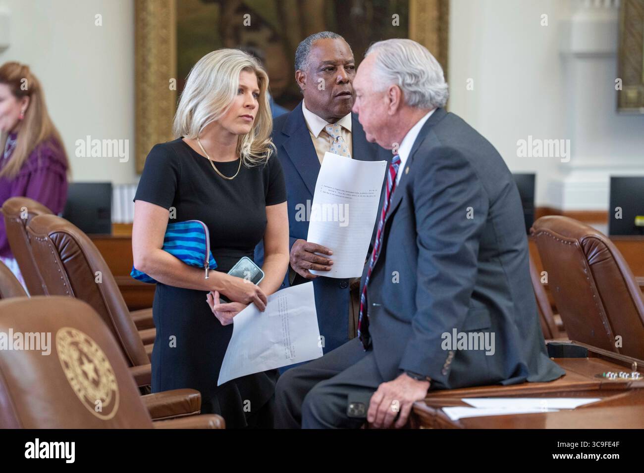Austin, United States. 05th Aug, 2025. State Rep. LACEY HULL, R-Houston, talks with Rep. DREW DARBY, R-San Angelo, during the second day that the Texas House failed to reach a quorum to do business on August 5, 2025. Many Texas Democrats have fled the state under threat of arrest by the Texas Governor. In the background is Rep. CHARLES CUNNINGHAM, R-Humble. Credit: Bob Daemmrich/Alamy Live News Stock Photo