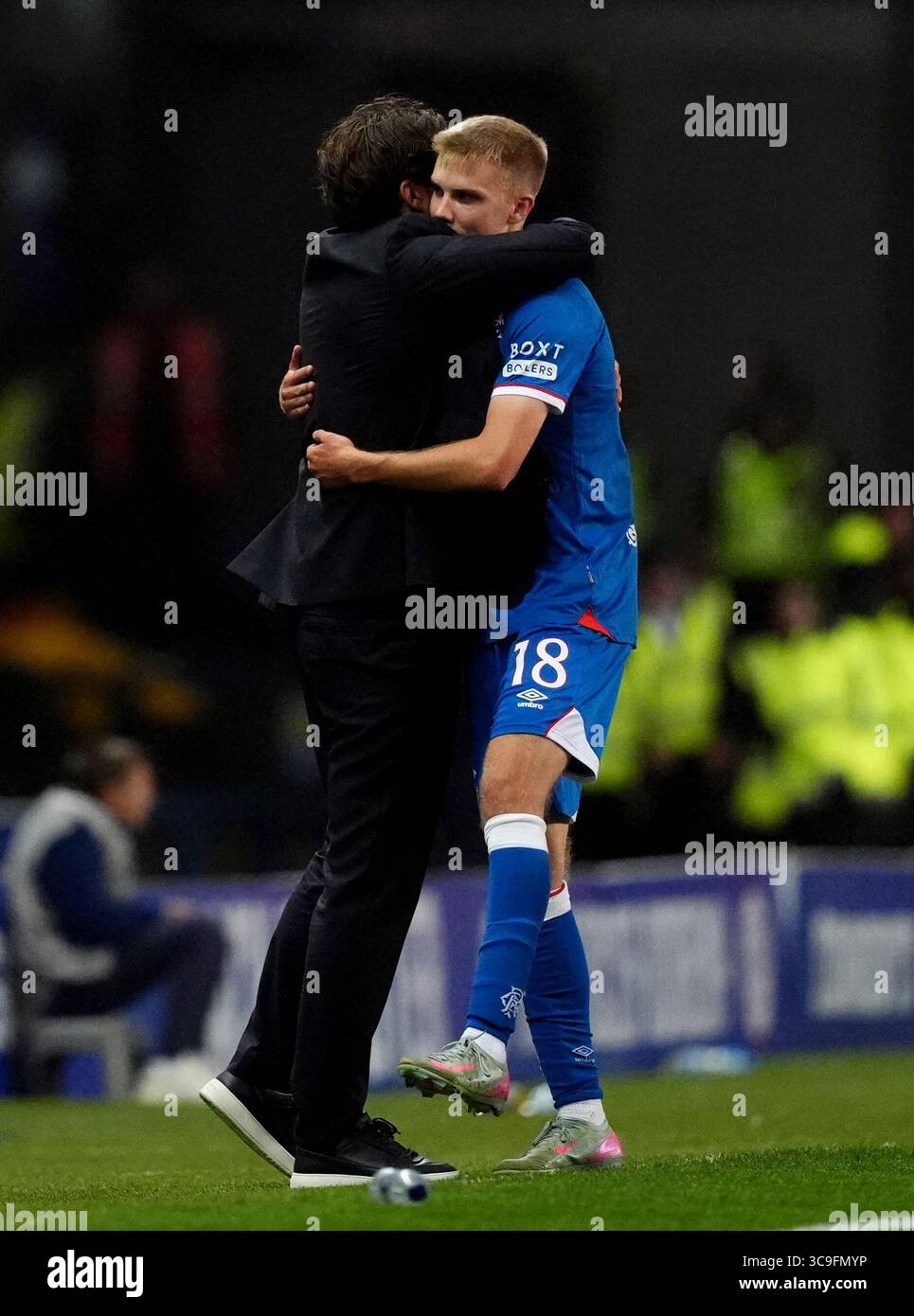 Rangers manager Russell Martin and Oliver Antman embrace after being ...