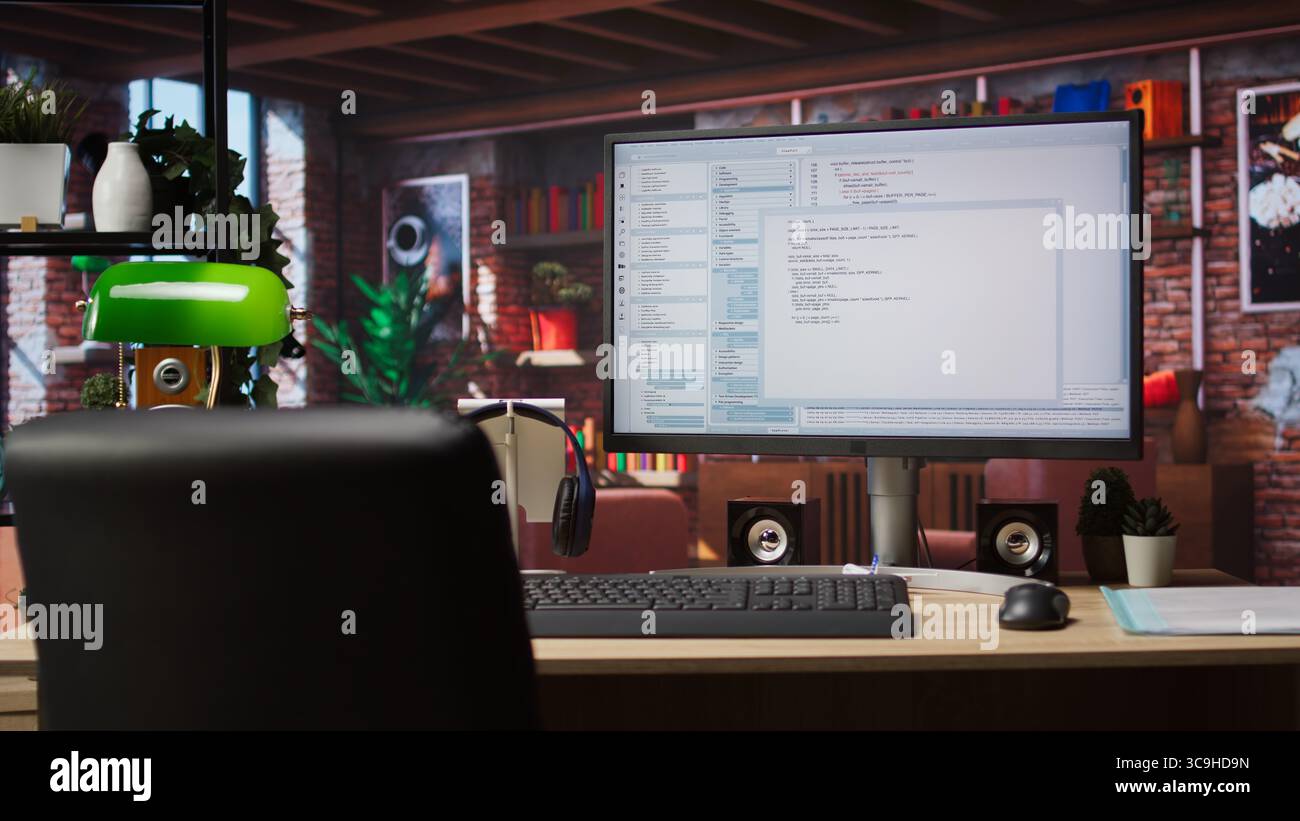 Lines of code written on PC workstation screen on development tool application. Debugging software programming language displayed on computer monitor in living room office Stock Photo
